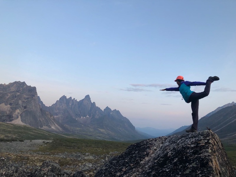 A person standing on a rock

Description automatically generated with low confidence