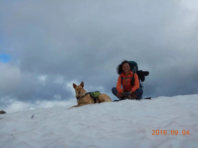 A couple of people that are sitting in the snow
Description automatically generated, Picture