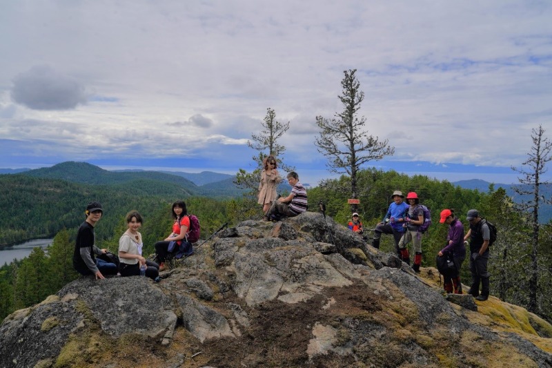 A person standing on a rocky hill
Description automatically generated, Picture