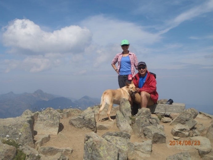 A person standing on a rock
Description automatically generated, Picture